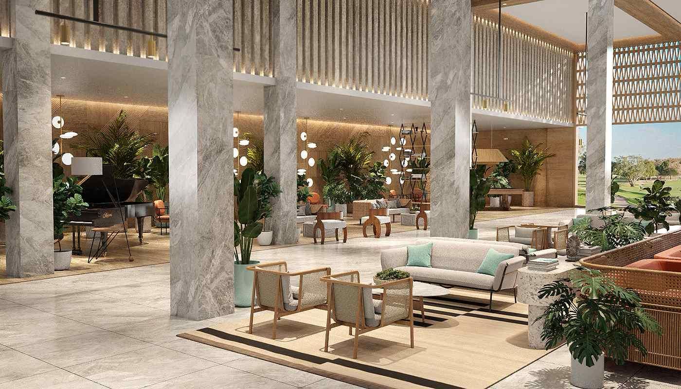 Lobby del Serenade Punta Cana con vegetación y espacios de descanso